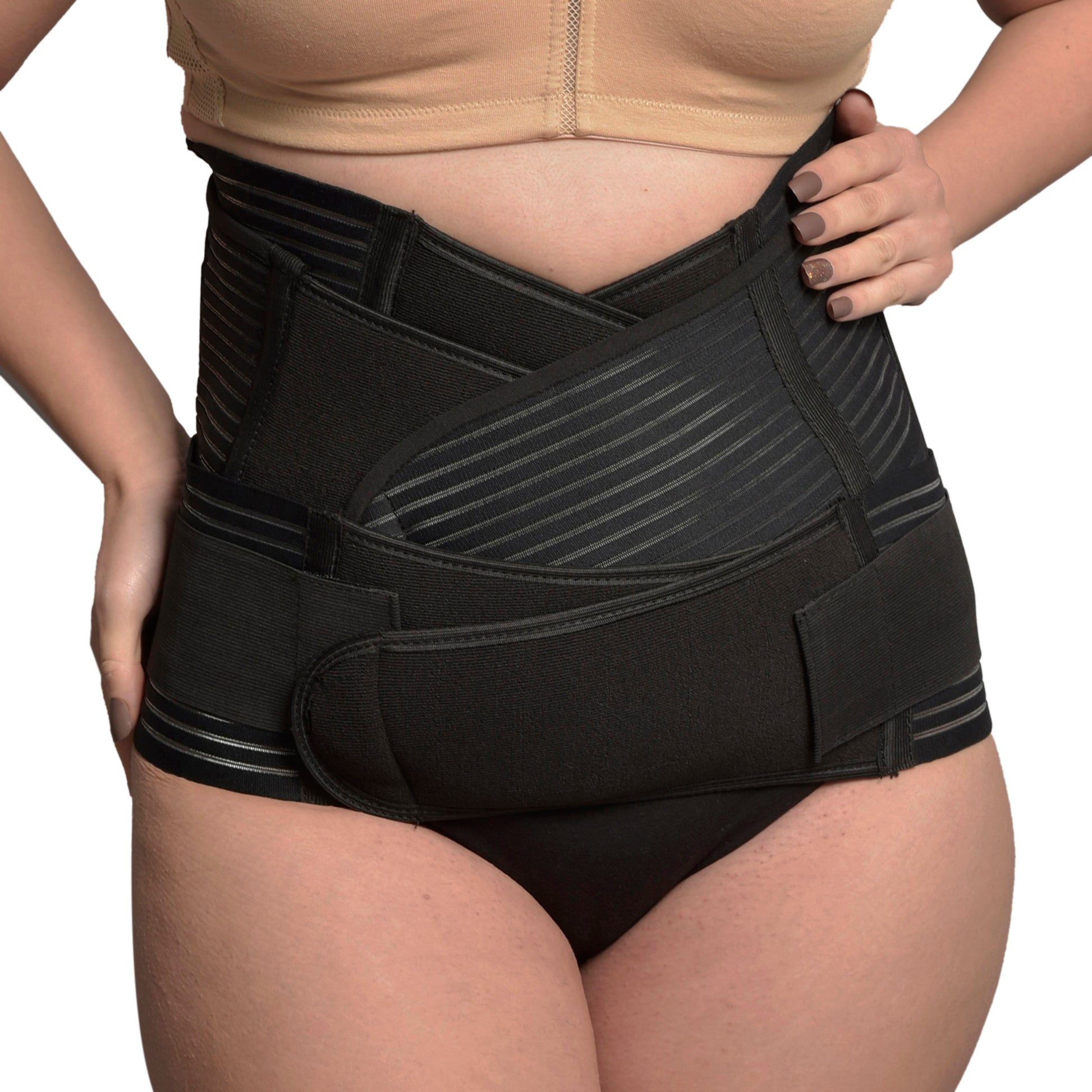 Woman wearing black 3-in-1 postnatal shapewear belly wrap for postpartum support