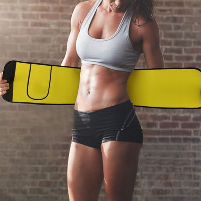 Woman wearing sportswear adjusting yellow fitness waist belt, brick wall background, IndianChic