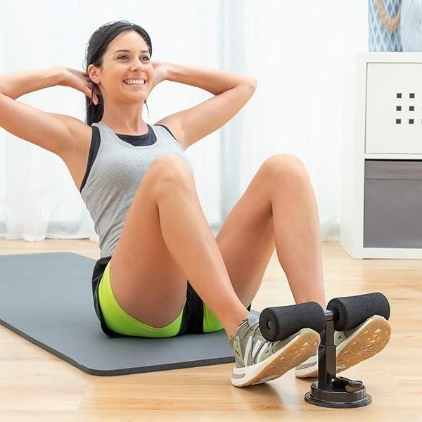 Woman using sit-up bar assistant on exercise mat for ab workout at home, IndianChic fitness gear